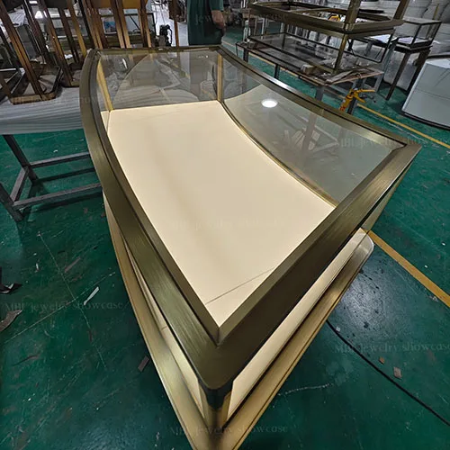 弧形组合式珠宝中岛销售柜定制 拉丝香槟金玻璃展示柜 商场珠宝店专用柜台