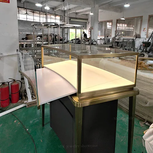 弧形组合式珠宝中岛销售柜定制 拉丝香槟金玻璃展示柜 商场珠宝店专用柜台